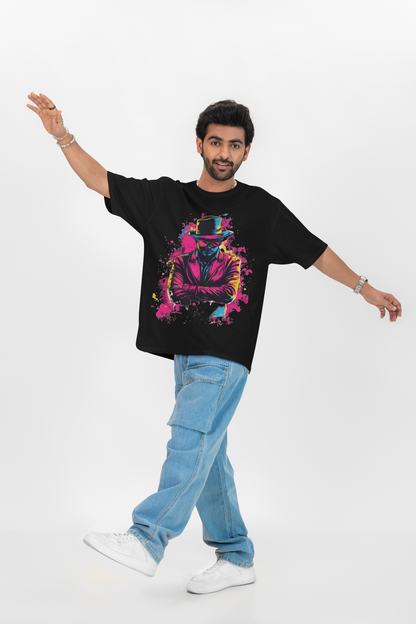 Person wearing a black oversized  t-shirt with colorful graphic design and blue jeans on a white background
